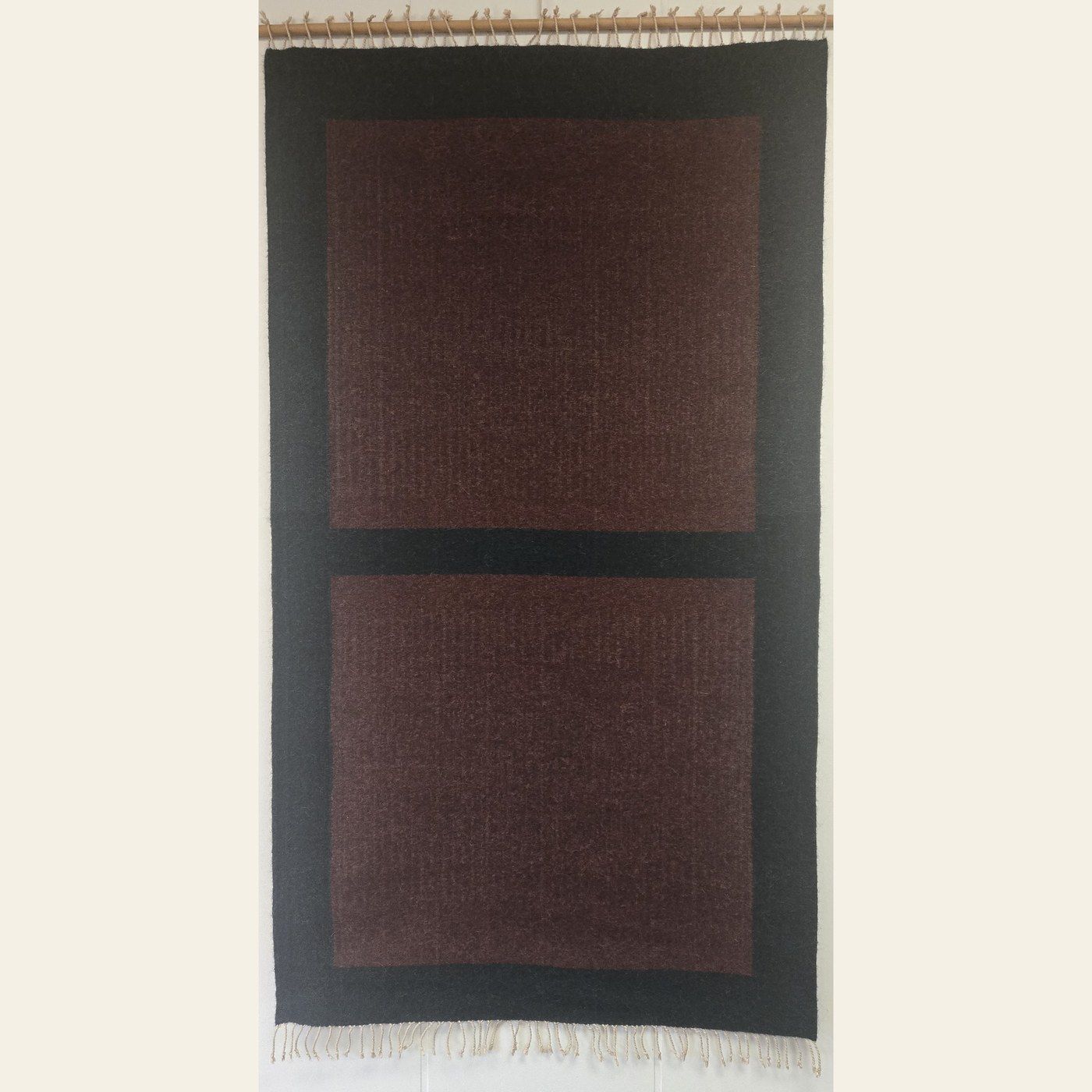 Hand-woven rug by Charles H. Blanchard, the Dyberry Weaver of Narrowsburg NY, with two deep brown panels set in a charcoal ground