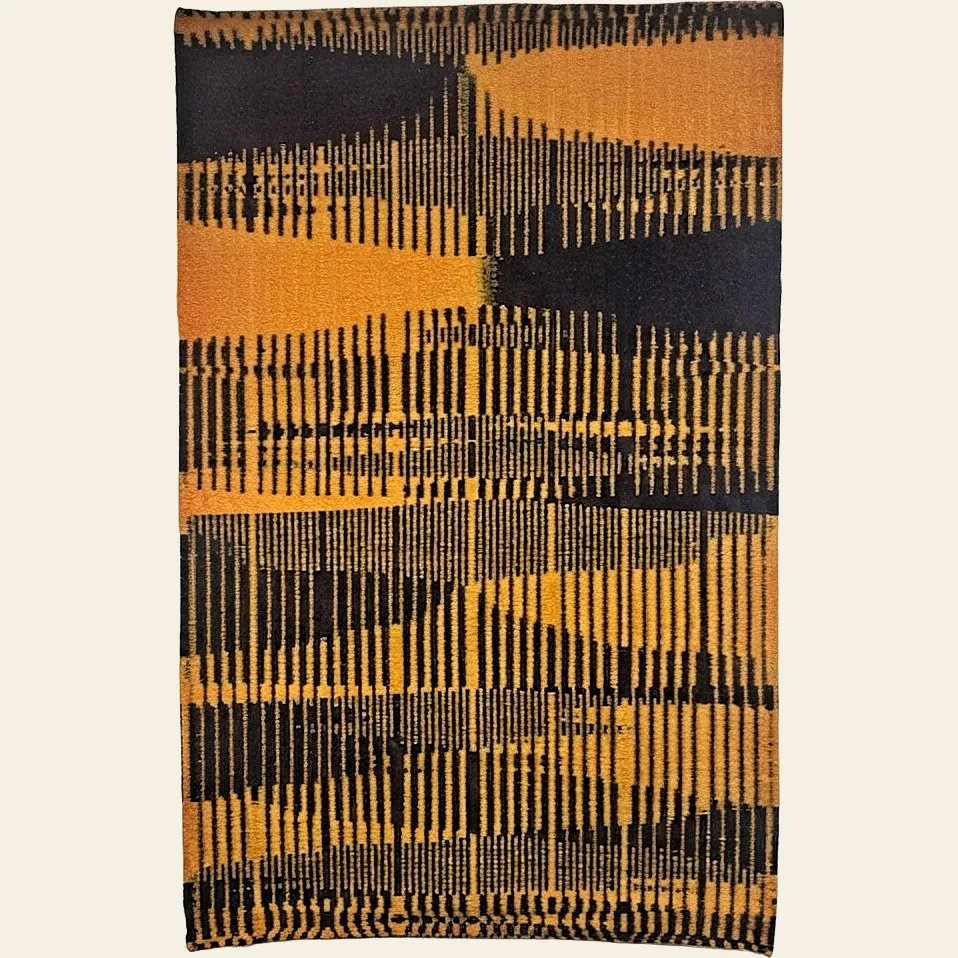 Hand-woven rug by Charles H. Blanchard, the Dyberry Weaver of Narrowsburg NY, with a bold abstract composition of interlocking combed bands in mustard gold and black