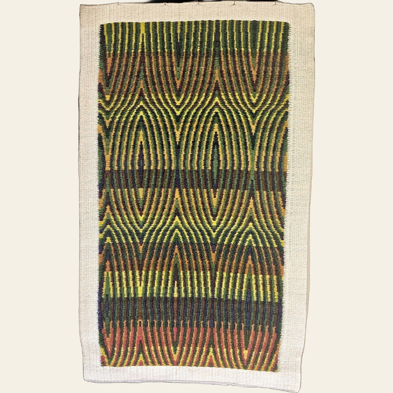 Hand-woven tapestry by Charles H. Blanchard, the Dyberry Weaver of Narrowsburg NY, with mirrored flame bands in green, gold, orange, navy and rose framed by a woven oatmeal border